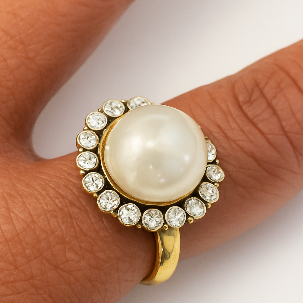 Vintage Pearl Halo Ring with a lustrous pearl and crystal halo on a gold-toned stainless steel band.