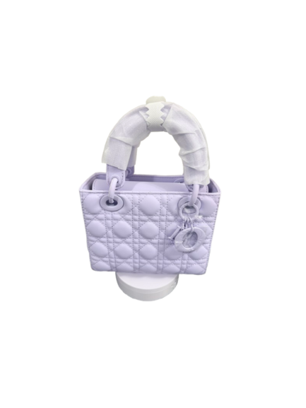 Lumivelle handbag in Lumen Lavender with GeoQuilt texture, showcasing stylish design and playful color.