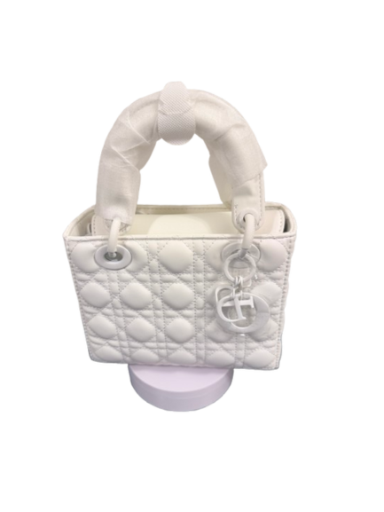 Lumivelle™ ÉLANTRA white quilted handbag on display with structured silhouette and bold design.